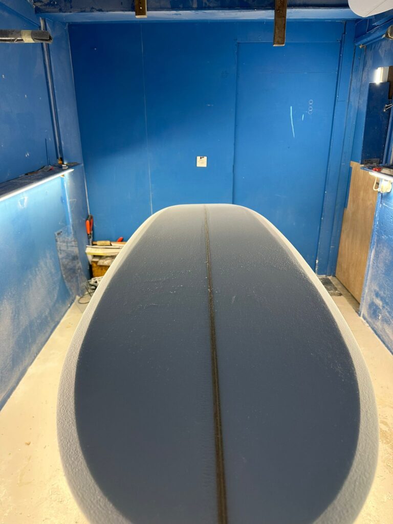 Surfboard shaping in progress at a professional workshop - Surfboards shaping & repair